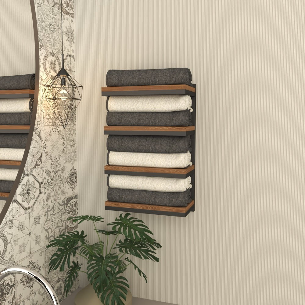 A closeup view of a 4-tier towel stacker with black metal and wood shelves, neatly organized with rolled towels, perfect for modern bathroom decor.