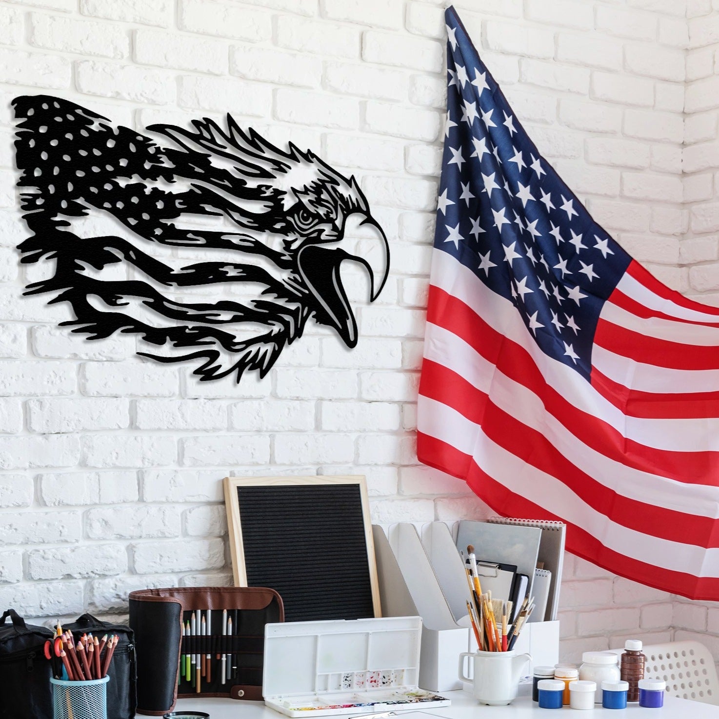 Metal wall art depicting a majestic American bald eagle with outstretched wings, perched on a weathered American flag. Ideal for Independence Day decoration or a patriotic gift