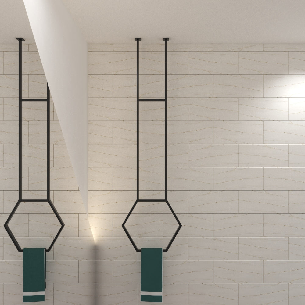 Hexagonal metal towel rack mounted on the bathroom ceiling.