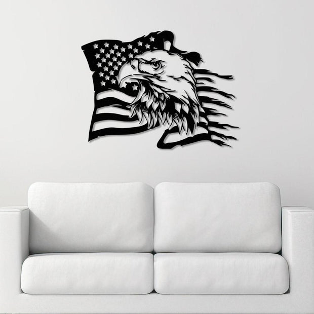 Black metal wall art featuring an American flag design intertwined with a bold eagle's head, mounted above a modern white sofa on a plain white wall.