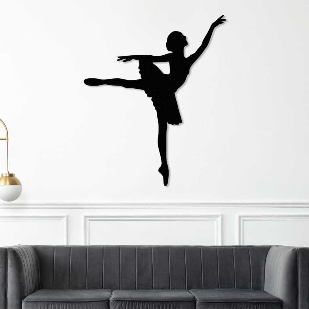 ballerina metal wall art on the sofa