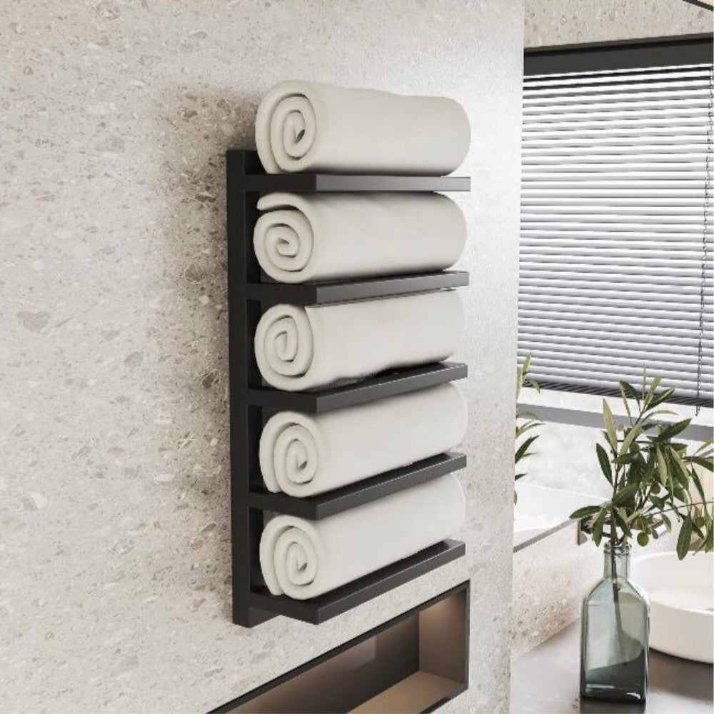 Wall-mounted black 5-tier towel rack holding neatly rolled white towels, displayed on a light beige wall in a modern bathroom