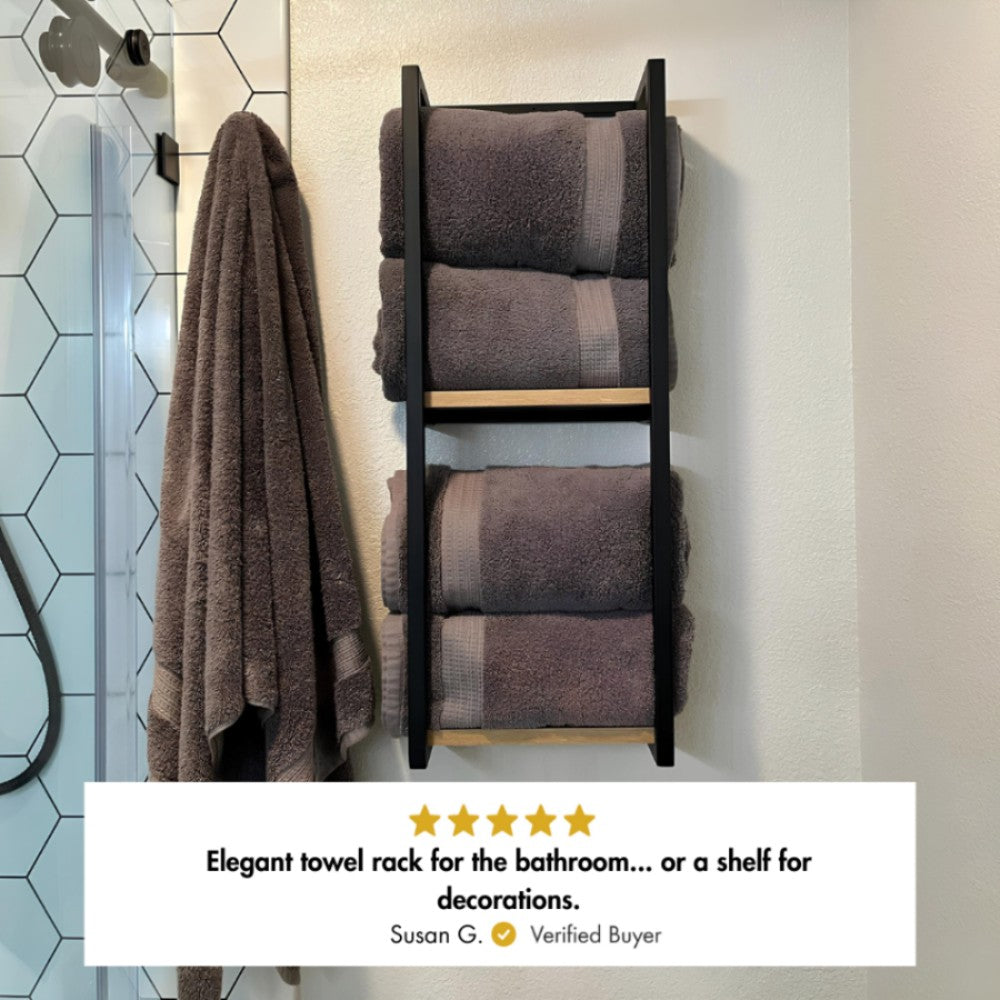 Two-tier mounted bathroom shelf for towel and blanket storage, two pieces with verified buyer Susan G. commenting as "elegant towel rack for the bathroom...or a shelf for decorations"