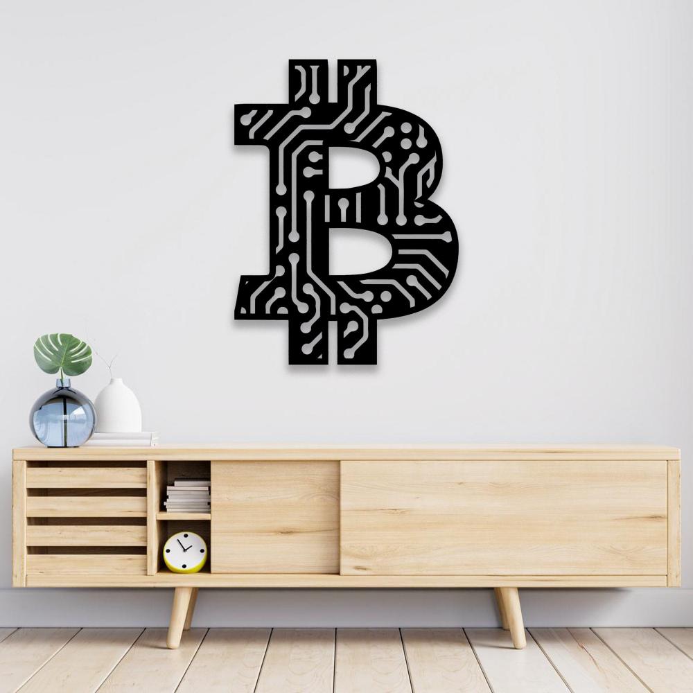 Black Bitcoin symbol wall art with intricate circuit board patterns, mounted on a white wall above a minimalist light wood console table, decorated with a green plant in a glass vase and modern accessories.