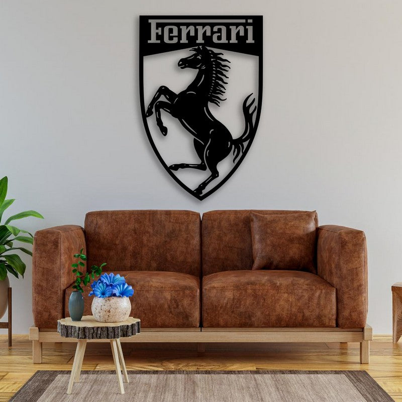 Black Ferrari-themed metal wall art featuring a prancing horse mounted above a brown leather sofa in a cozy living room setting with natural wood and green plant accents.