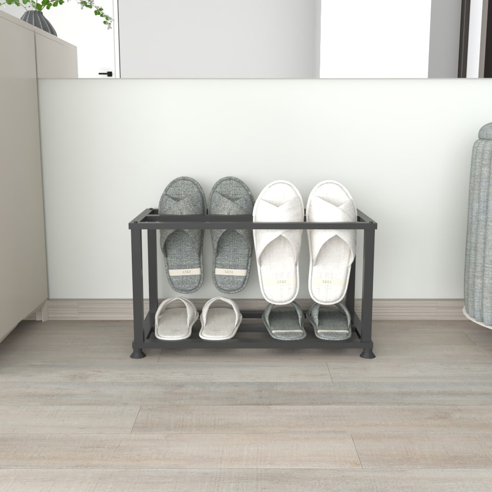 A black metal double-layer slipper rack showcasing its storage capacity with neatly arranged slippers in an organized living space