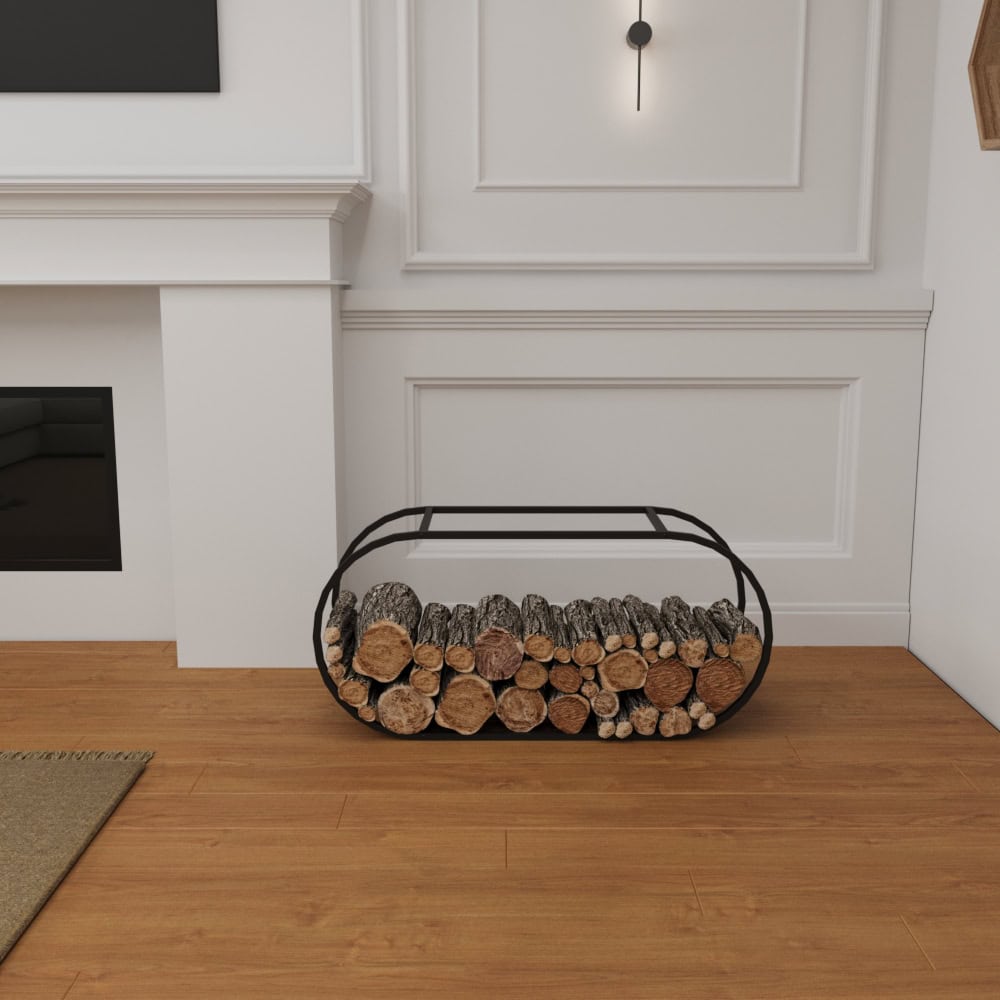 A black oval-shaped metal firewood holder placed against a white wall near a modern fireplace, filled with neatly arranged firewood on a wooden floor