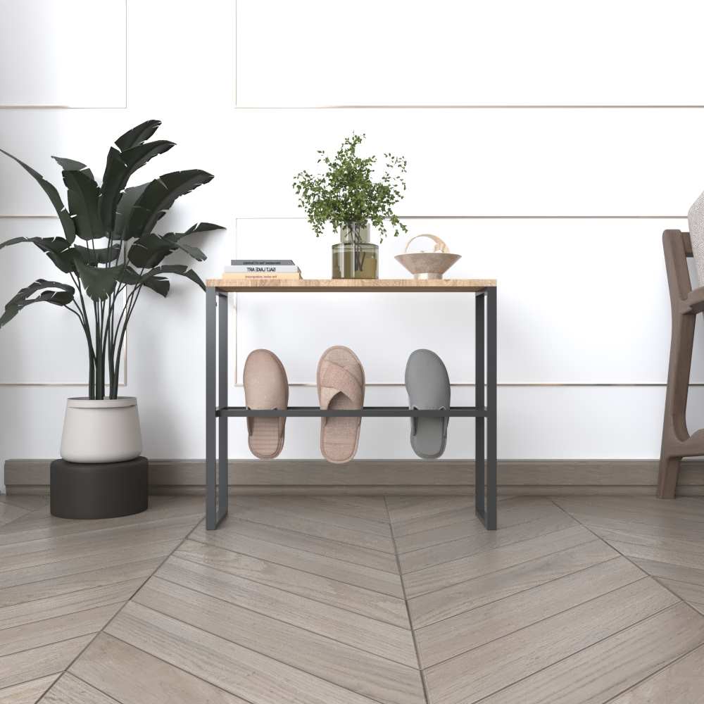  A black metal slipper rack with a wooden top, holding slippers on the lower bars and decorated with books and plants, placed in a sophisticated interior setting.