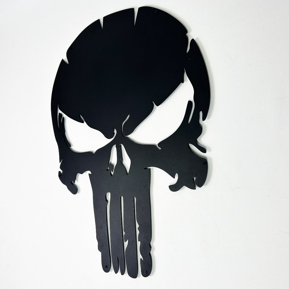 Close-up view of a black Punisher skull metal wall art with bold, sharp details and sleek edges, mounted on a white background.