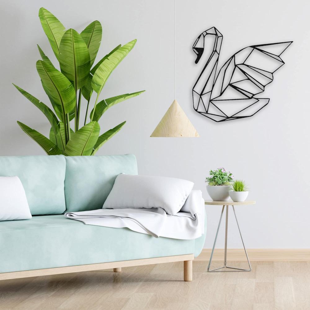 A geometric swan metal wall art on a white wall near a minimalist light wood sofa, accented with a tall green plant and triangular hanging lamp. 