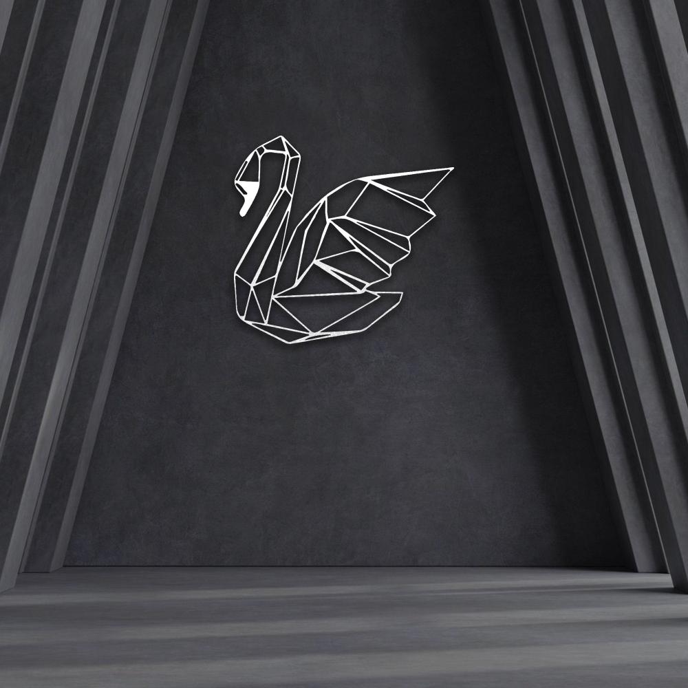 A white geometric swan metal wall art placed on a dramatic dark background with subtle light accents. 