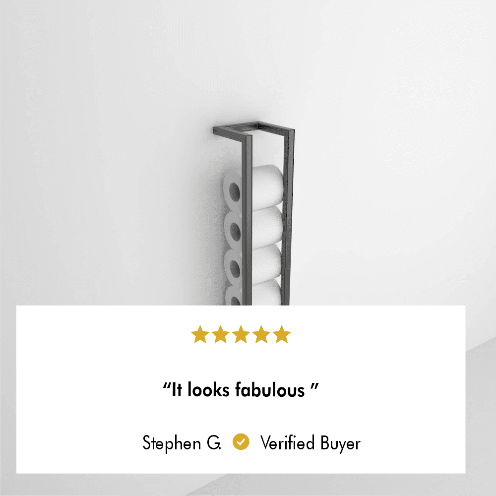 A minimalistic black wall-mounted toilet paper holder displayed against a plain white background. A five-star review overlay reads, "It looks fabulous," attributed to Stephen G., a verified buyer.