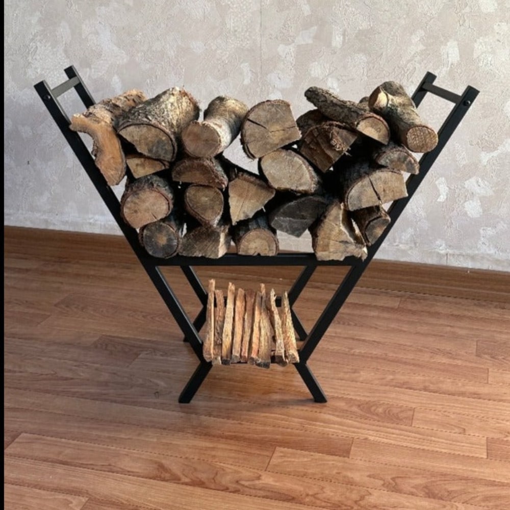 A close-up view of a black V-shaped metal wood rack filled with firewood, showcasing its compact and functional design, placed on a wooden floor Image