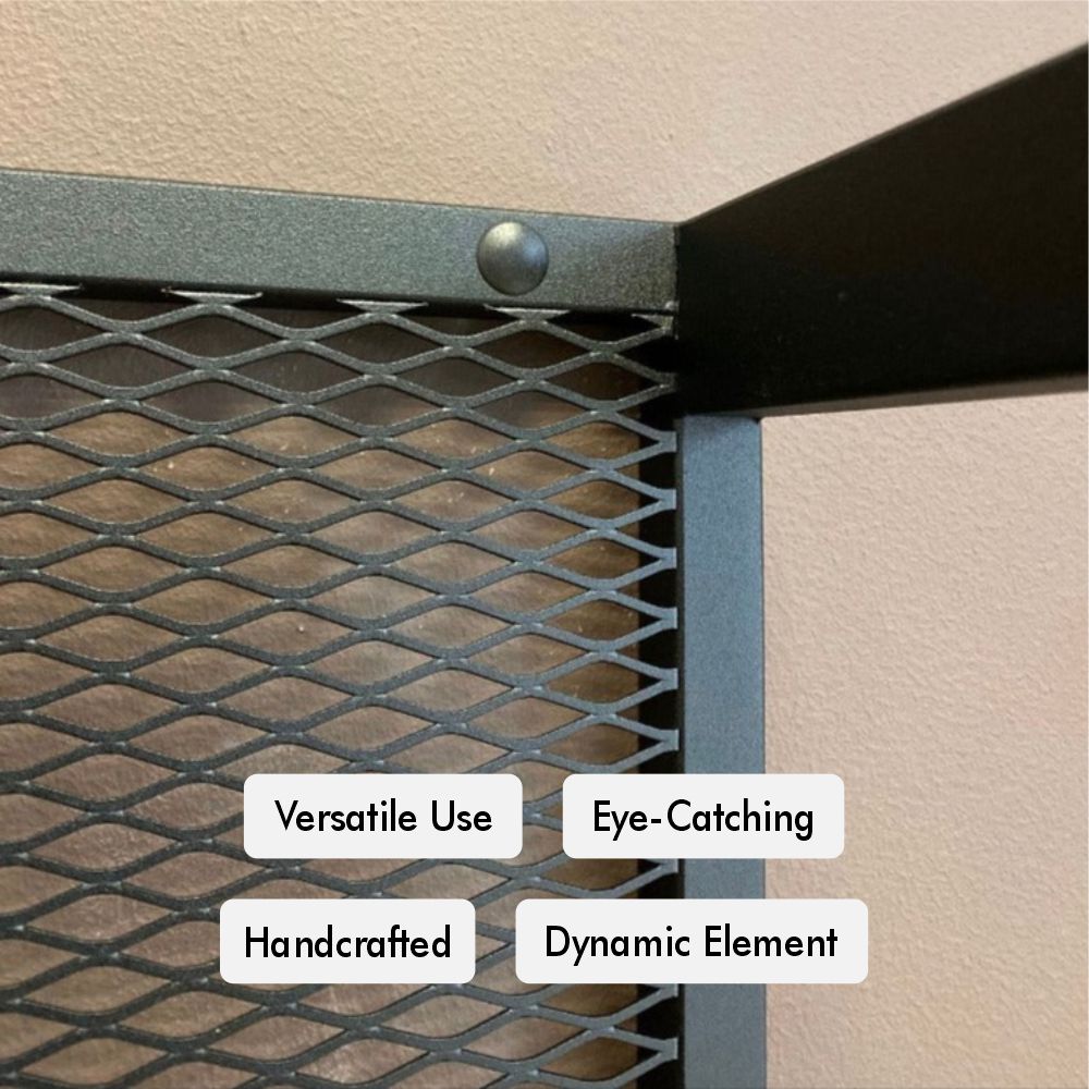 Close-up detail of a wall-mounted firewood holder showcasing the robust metal mesh with a handcrafted finish. The black powder-coated surface highlights its dynamic and eye-catching design, demonstrating the quality craftsmanship and versatile use in any modern home setting.