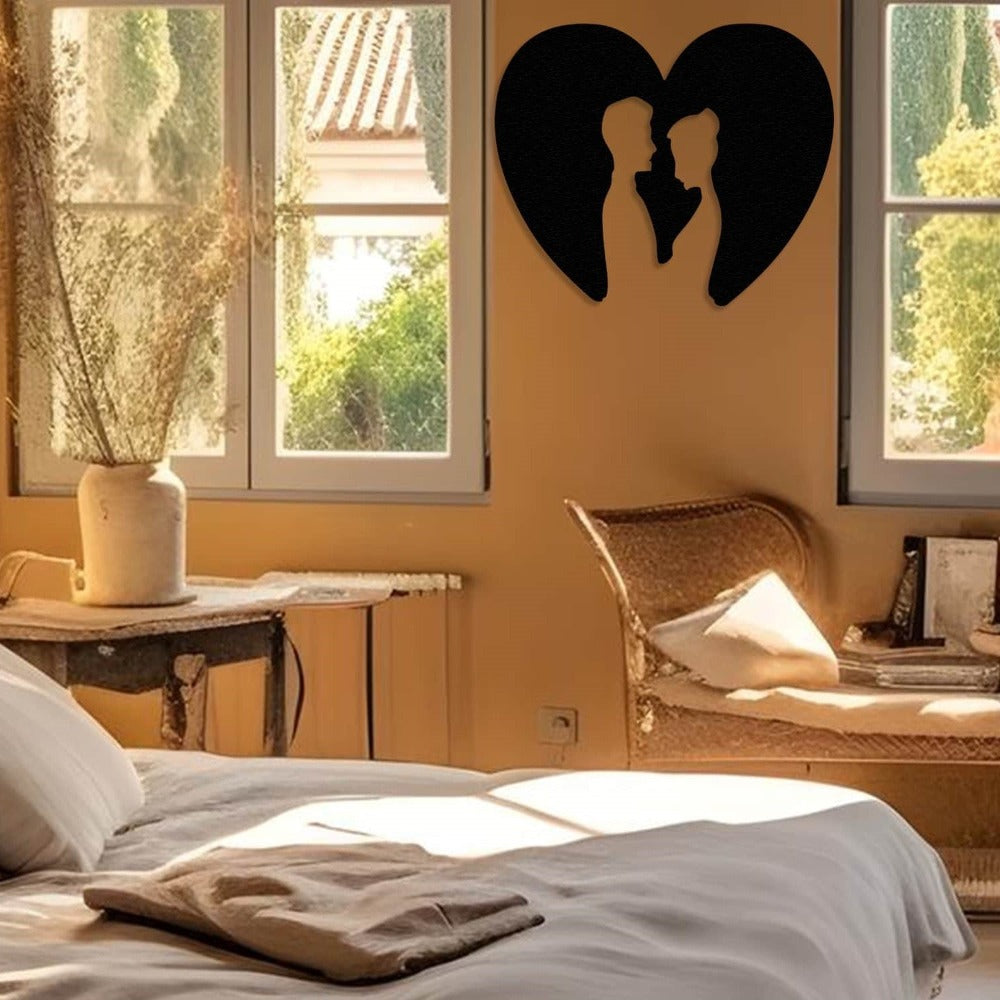 couple with heart next to the bed