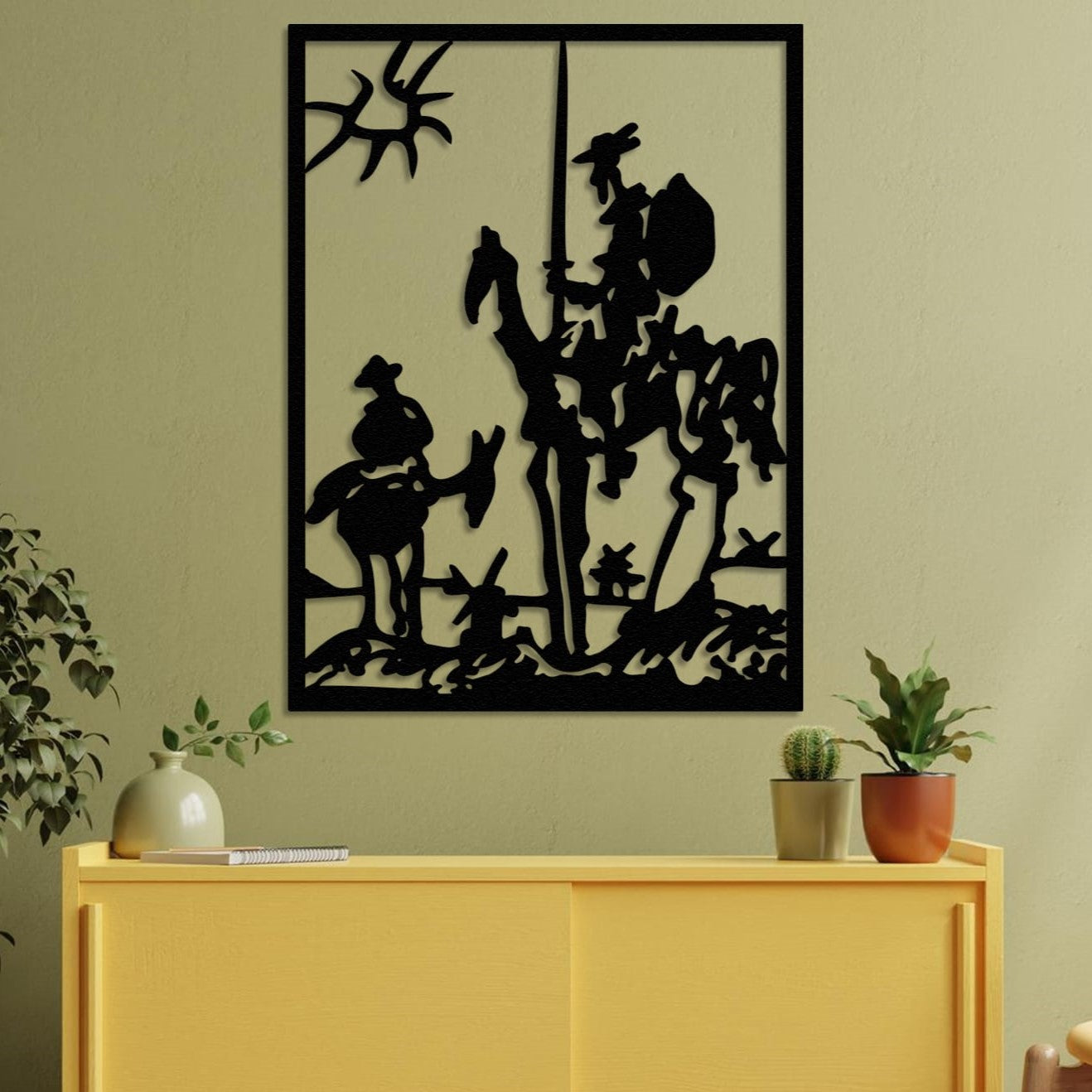 don quixote wall art on the table