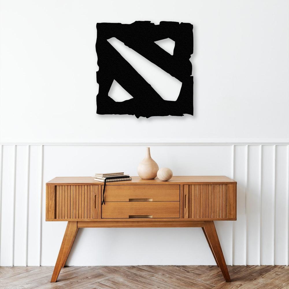 dota metal wall decor on the table