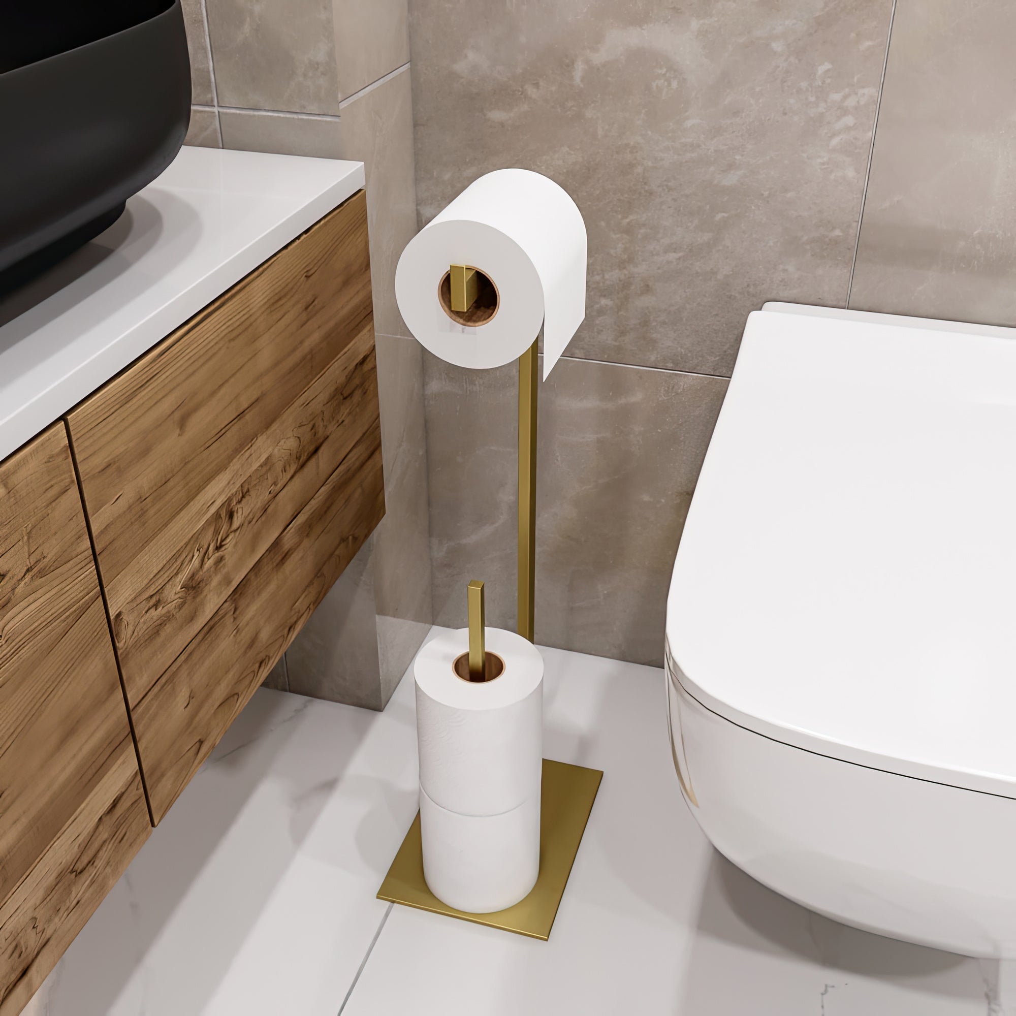 Elegant gold toilet paper holder stand in a modern bathroom, featuring a sleek design with a wooden cabinet and stone tile backdrop. The stand includes a mounted roll and additional storage for spare rolls, blending luxury with minimalist aesthetics."