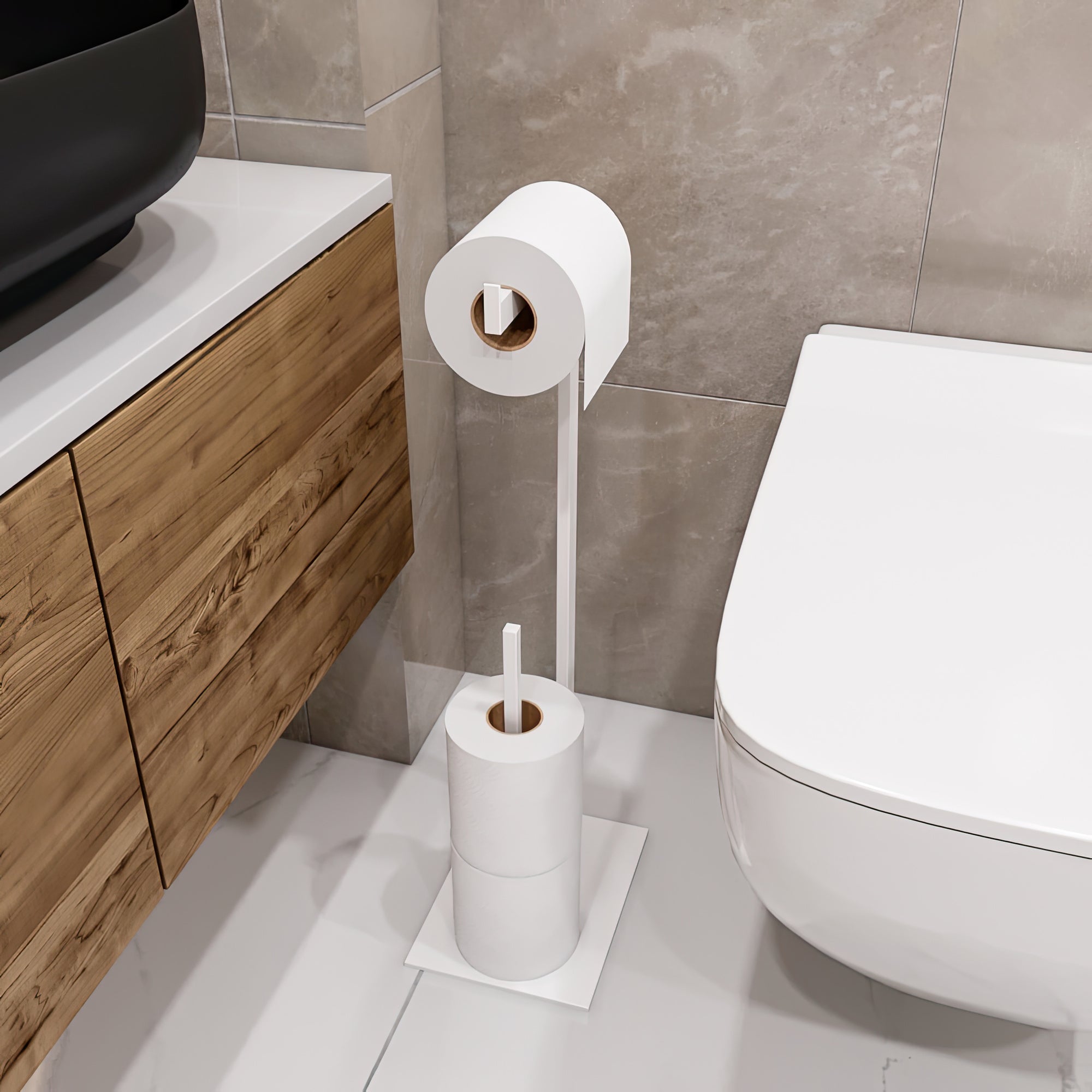 Elegant white toilet paper holder stand in a modern bathroom setting, featuring a sleek design with a wooden cabinet and a stone tile backdrop. The stand includes a mounted roll and additional storage for spare rolls, blending functionality with a minimalist aesthetic."