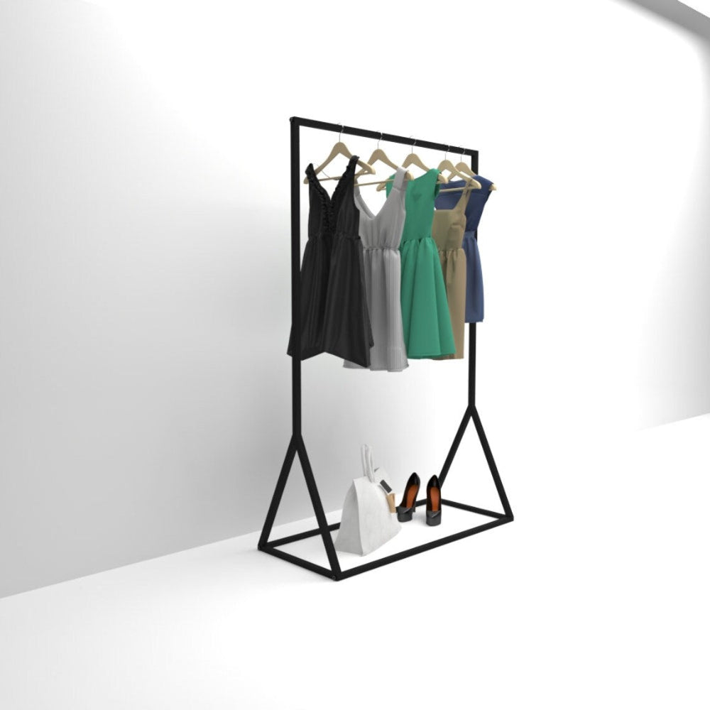 A side view of a freestanding black metal clothes rail holding dresses, with additional storage for shoes and bags at the bottom shelf.