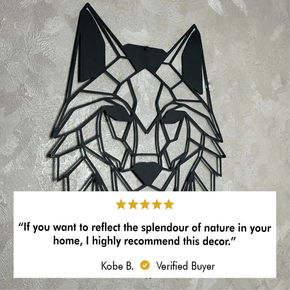 A close-up of geometric wolf head metal wall art mounted on a textured wall. Below the artwork is a 5-star customer review from a verified buyer, Kobe B., stating: "If you want to reflect the splendor of nature in your home, I highly recommend this decor."