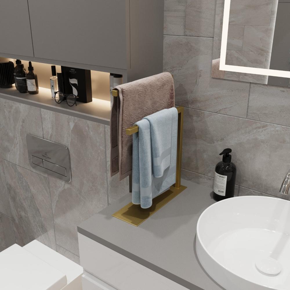  A gold countertop towel holder placed on a bathroom countertop, adding a luxurious touch to the decor while keeping towels neatly organized.