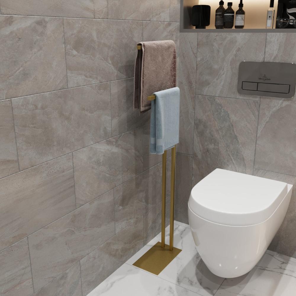 A standalone gold towel holder with a minimalist design, suitable for small spaces, displayed against a white background.