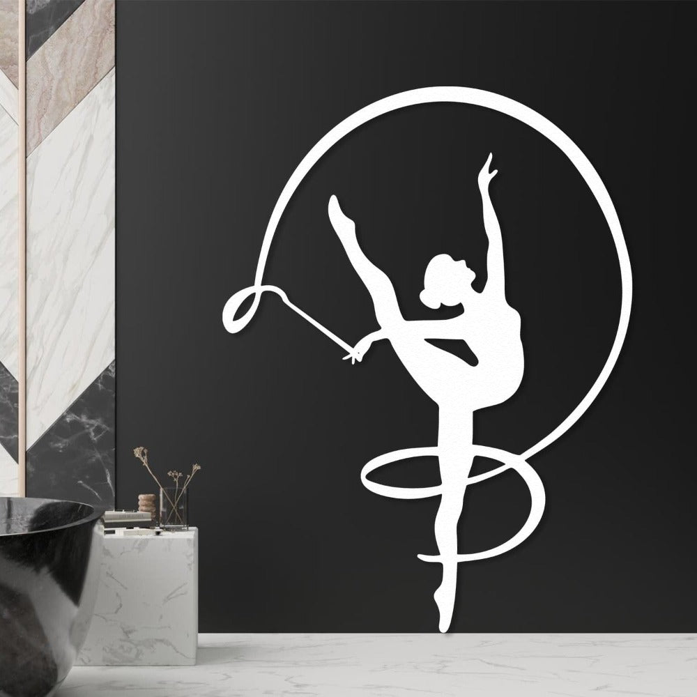 Metal wall decor depicting a determined gymnast girl mid-balance.