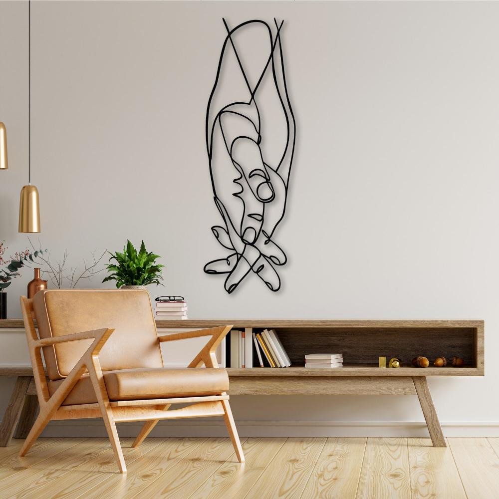 Artistic line art of intertwined hands placed in a modern living room with a wooden shelf and leather chair.