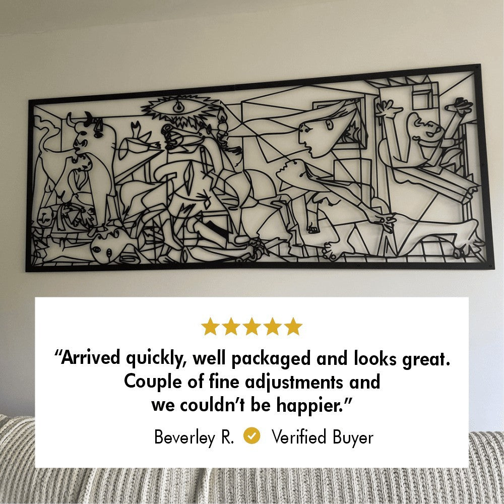 Large black metal wall art, Pablo Picasso's Guernica, mounted on a white wall, with a five-star customer review below stating, 'Arrived quickly, well packaged and looks great. Couple of fine adjustments and we couldn't be happier.' by Beverley R., a verified buyer.