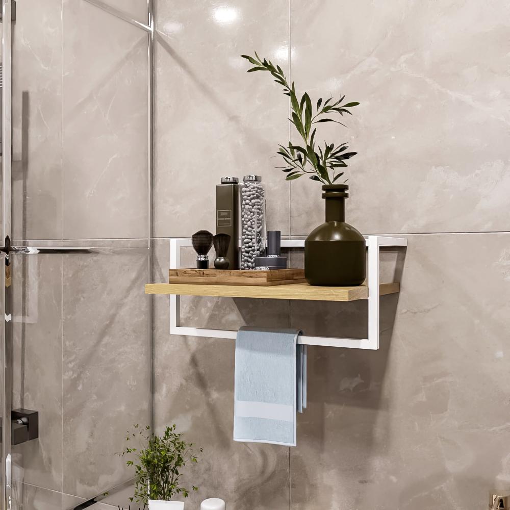 A modern bathroom shelf with a white metal frame and wooden plank, styled with green and neutral decor, and a towel hanging below.