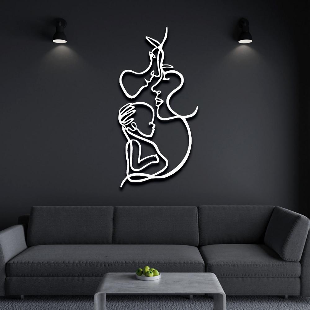 Illuminated white metal family line art decor, placed on a dark wall above a gray sofa with ambient lighting.