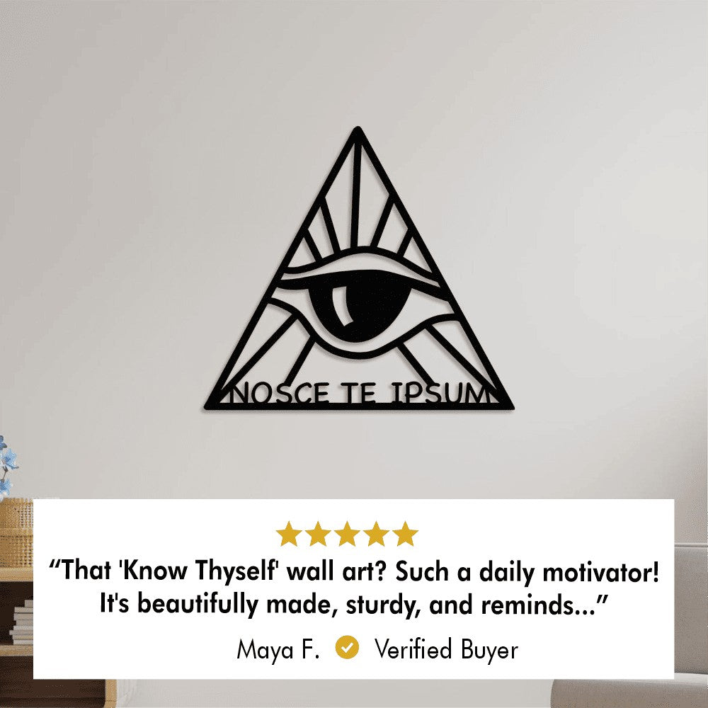 A black metal wall art featuring the all-seeing eye inside a triangle, with the Latin phrase "NOSCE TE IPSUM" (Know Thyself) below. The image includes a positive customer review from Maya F., who describes the wall art as a daily motivator and praises its quality and design.