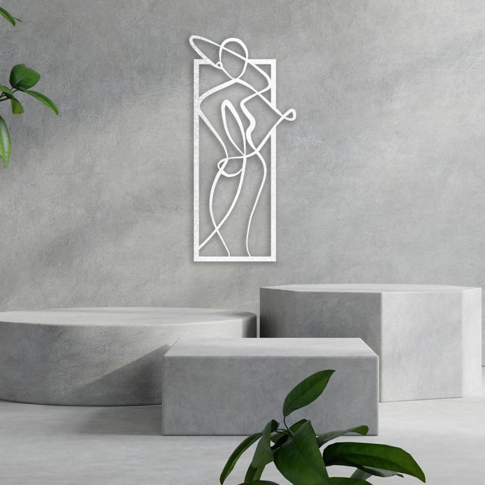 Elegant white metal wall art of a woman in a hat, mounted on a textured gray wall with a contemporary setting