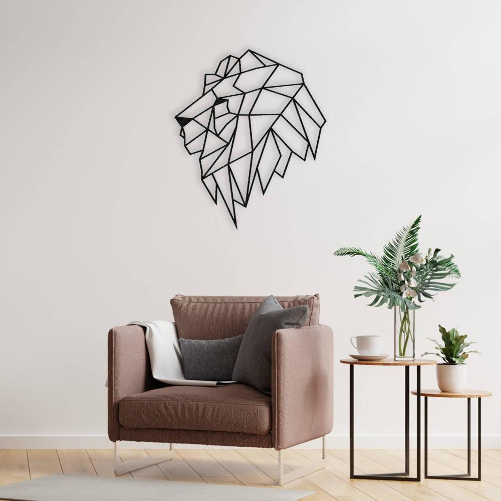 A geometric lion head metal wall art displayed in a cozy reading nook with a modern armchair and a side table adorned with plants and books.