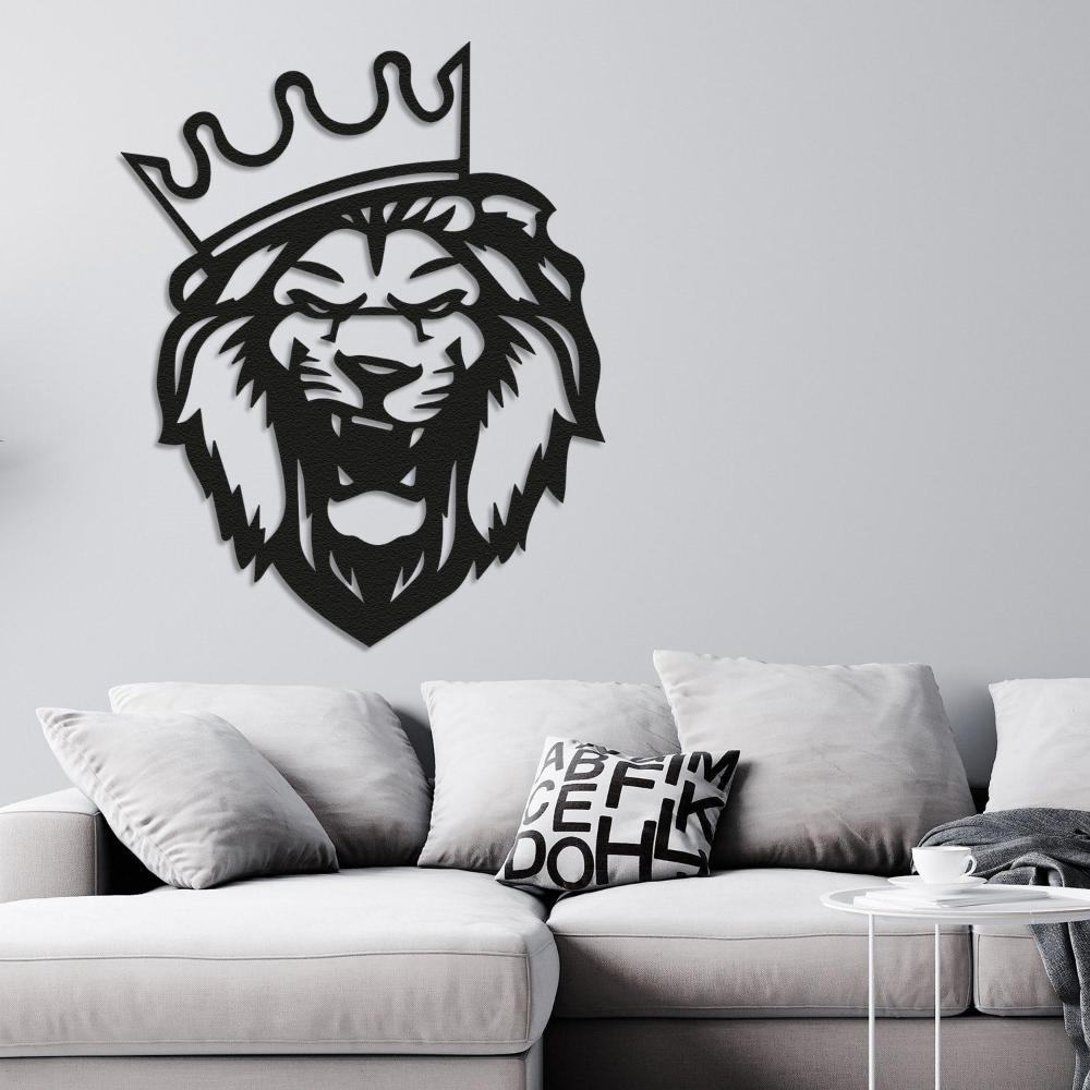 Black metal lion head wall art with a crown mounted on a light gray wall above a modern white sofa, decorated with monochrome cushions, creating a sophisticated living room decor.