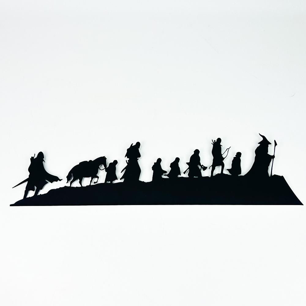 Black "Lord of the Rings" metal wall art showcasing the iconic silhouettes of the Fellowship of the Ring against a plain white background, highlighting intricate details of each character.