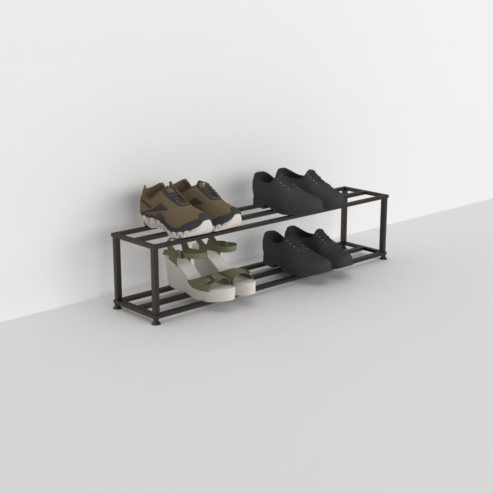 Minimalist two-tier metal shoe rack holding three pairs of shoes, displayed against a plain white background, offering a sleek and functional storage solution.