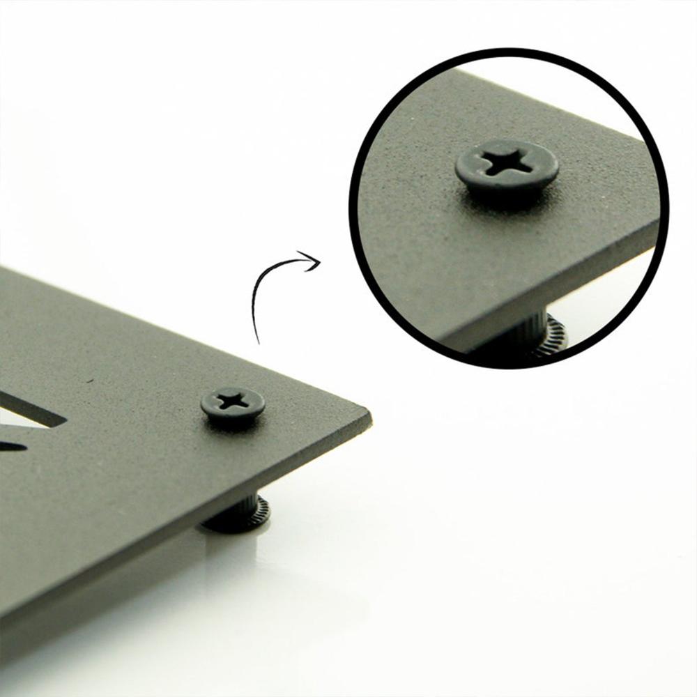 Close-up view of a metal wall art mounting detail, showing a secure screw and spacer system for easy wall installation.