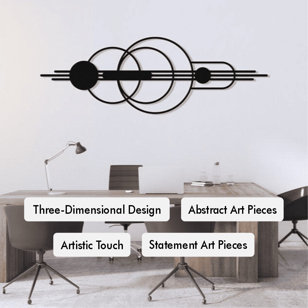 Abstract geometric wall art featuring overlapping circles and horizontal lines in a three-dimensional design, displayed above a modern wooden office desk surrounded by sleek black chairs, emphasizing an artistic and mid-century modern touch.