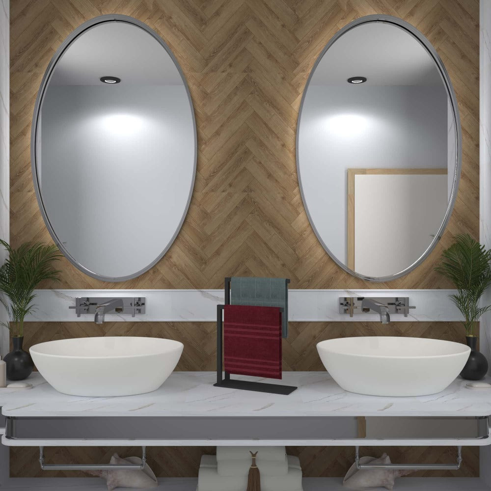 A minimalist black countertop towel holder displayed on a bathroom counter with a wooden accent wall, emphasizing its compact design and modern functionality for towel organization.