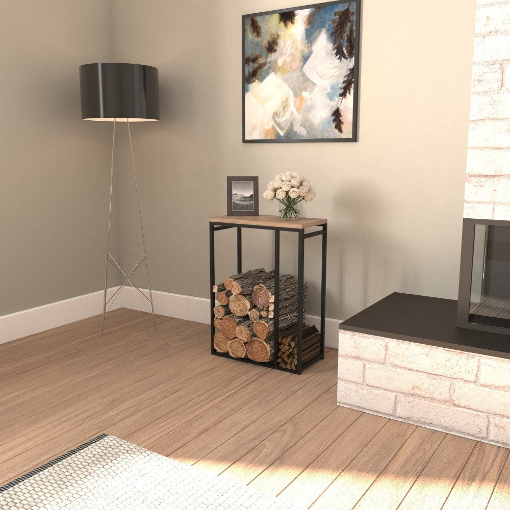 A minimalist metal log rack with a natural wood top placed beside a fireplace in a cozy living room, decorated with a standing lamp and wall art.