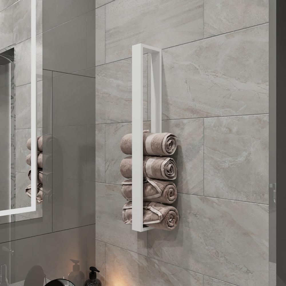 A modern, minimalist vertical towel storage rack in white, mounted on a bathroom wall with gray tiles. The rack neatly holds several rolled towels, providing an elegant and organized storage solution for the bathroom.