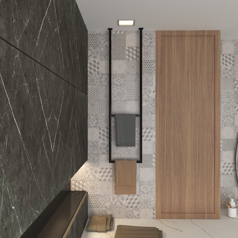 A modern bathroom design featuring a ceiling-mounted black towel rack, elegantly holding gray and beige towels, against a patterned tile wall with wood and marble accents.