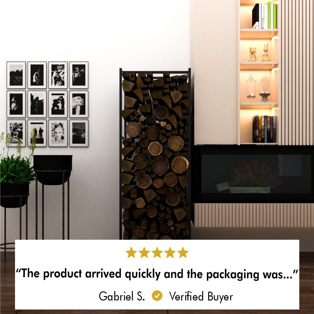 Black metal firewood rack filled with neatly stacked firewood, placed in a stylish living room. To the left are plants in tall black pots and a wall with framed black-and-white photos. On the right, a modern built-in shelf with decorative items and books is illuminated. Below the image, a 5-star customer review states: "The product arrived quickly and the packaging was…" attributed to Gabriel S., marked as a verified buyer.