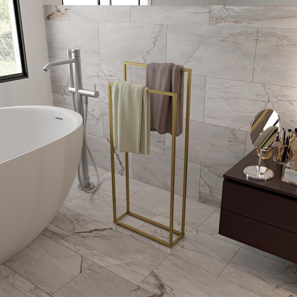 Luxurious bathroom scene featuring a modern gold free-standing towel rack holding neatly folded towels, adding elegance and functionality to a contemporary marble-tiled bathroom.