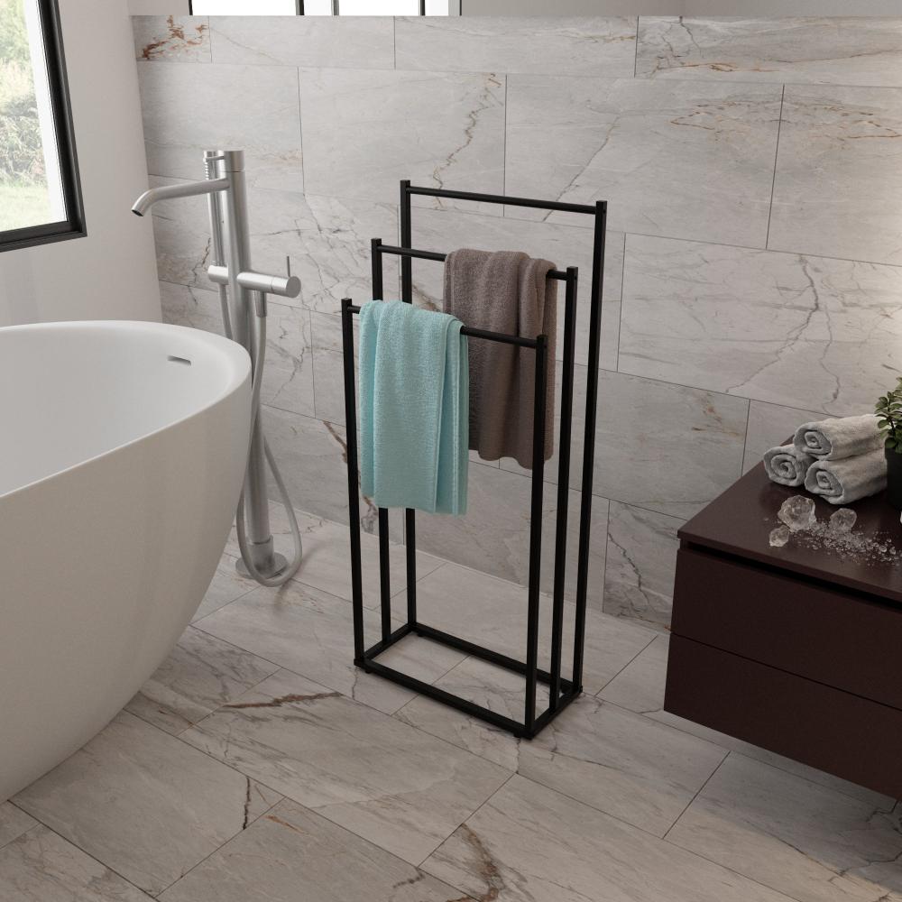 Contemporary bathroom setup featuring a sleek black floor-standing towel rack holding neatly arranged towels, complementing the luxurious marble tile walls and a modern freestanding bathtub.