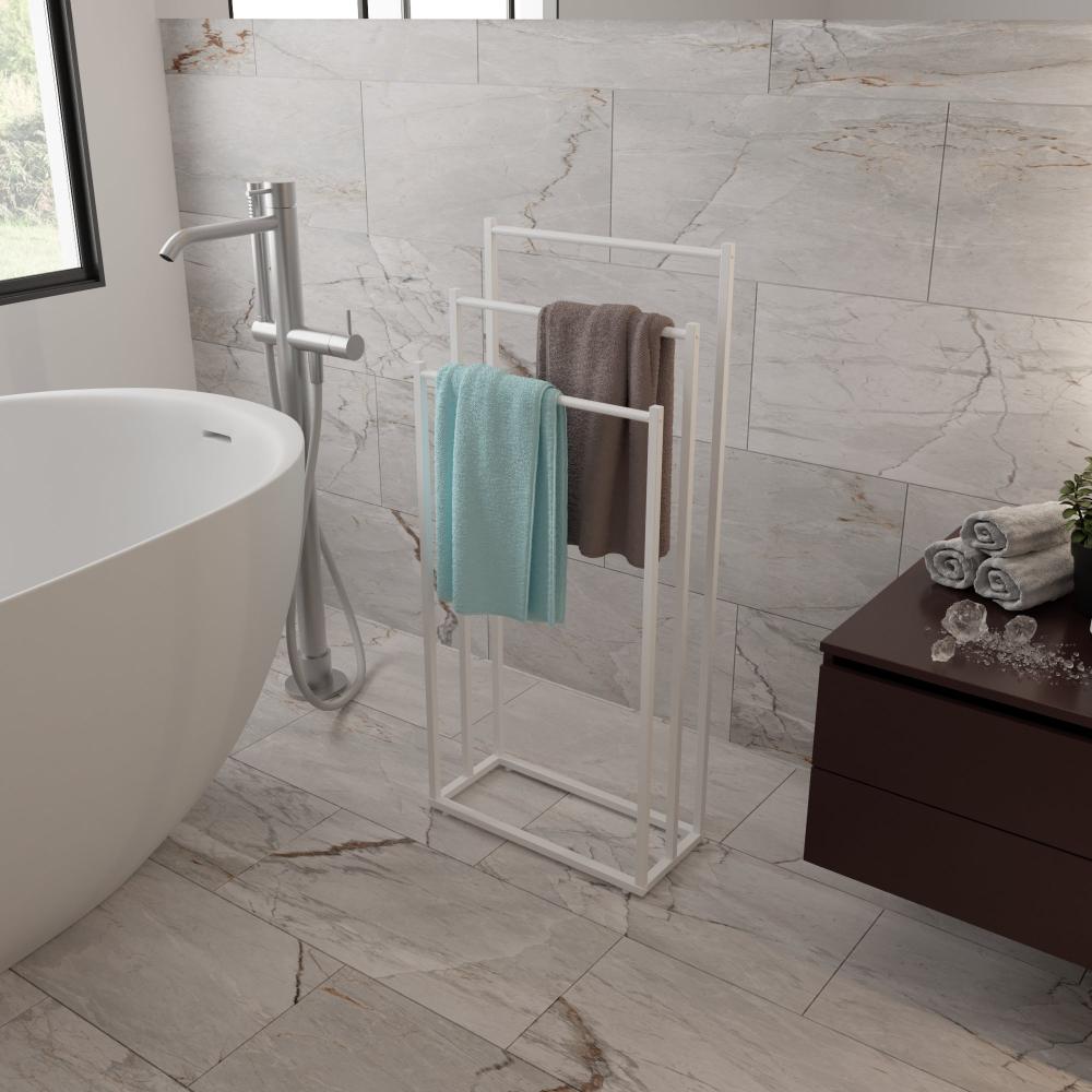 Minimalist bathroom featuring a sleek white floor-standing towel rack holding neatly hung towels, complementing the modern freestanding bathtub and the light gray marble tile walls for a clean and contemporary look.