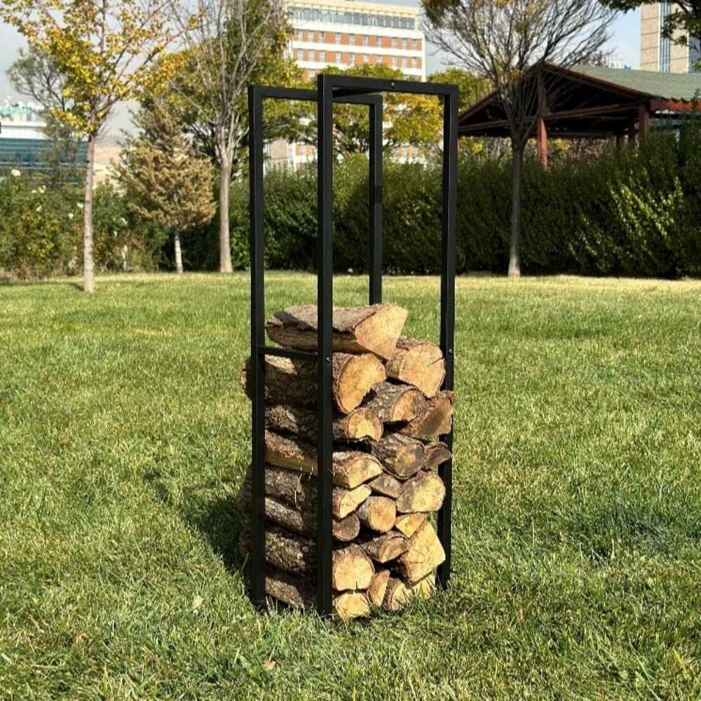 A black metal firewood rack filled with logs, placed outdoors on a green lawn. The rack stands tall and showcases its sturdy construction, ideal for organizing firewood in outdoor settings