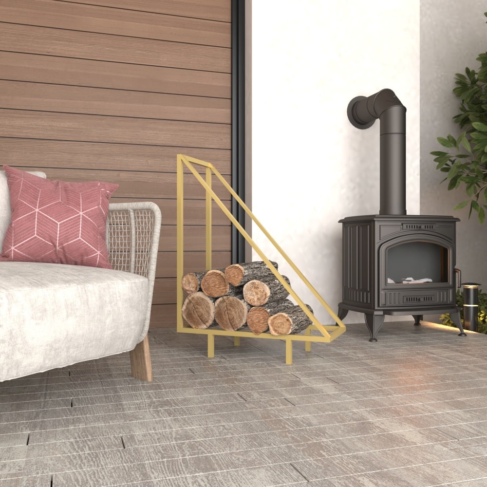 A gold metal wood rack with a modern triangular structure, displayed indoors near a wood stove, showcasing its luxurious and stylish design while storing firewood neatly.